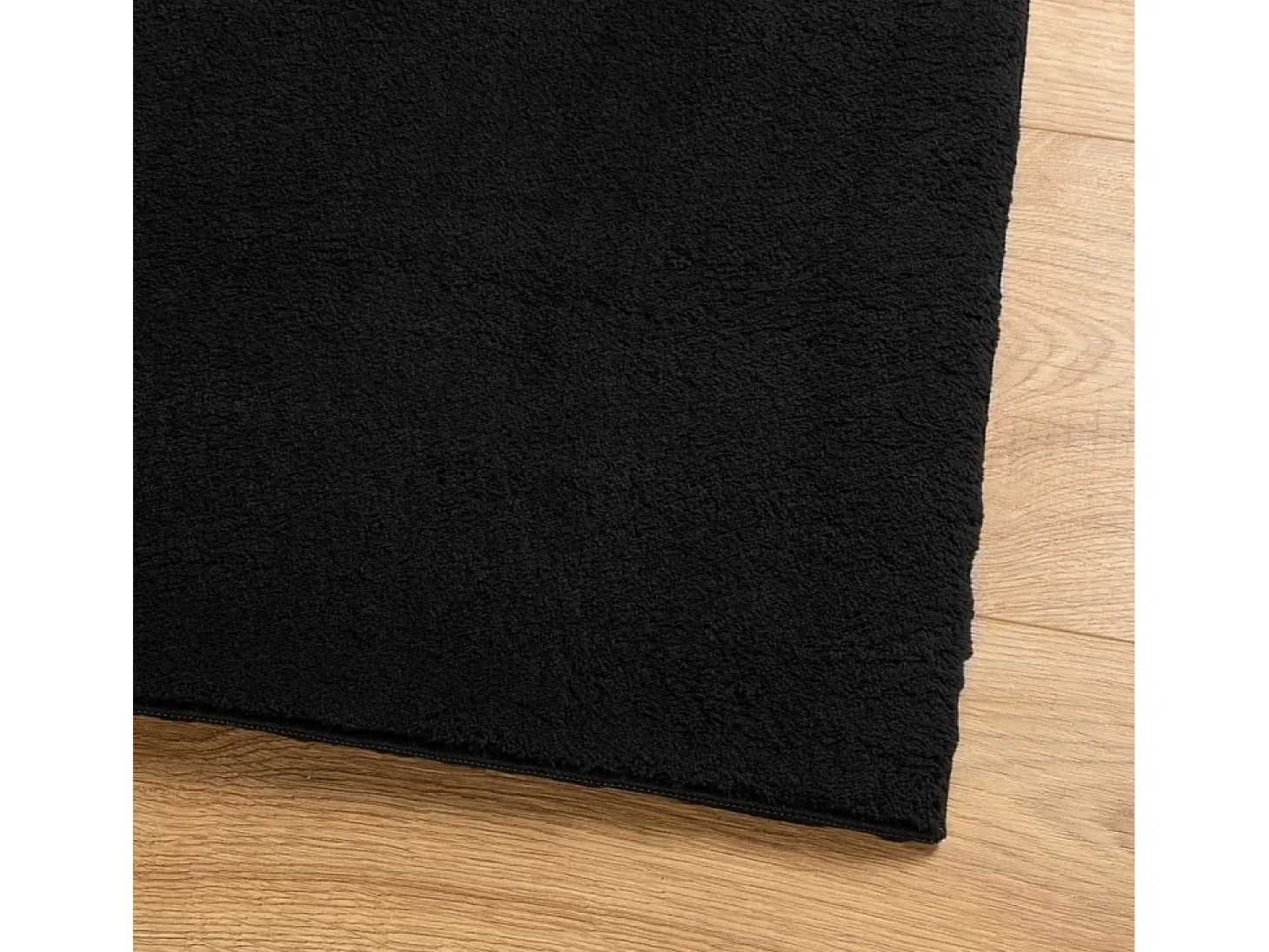 Alfombra HUARTE de pelo corto suave y lavable negra 80x200 cm