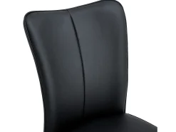 Juego de 2 sillas de comedor con asiento de piel sintética y patas de metal negras.
