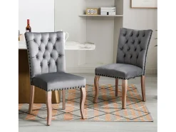 Juego de 2 sillas de terciopelo gris con patas de madera curvadas, remaches negros