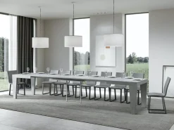 Mesa de comedor extensible de madera Kristo patas en V-Color Gris cemento-Soporte 4 pies-5 alargaderas finas-Ancho extensible
