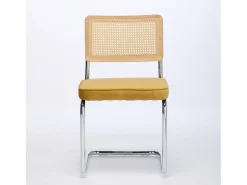 Silla de comedor - asiento voladizo de terciopelo con respaldo de ratán tejido dorado