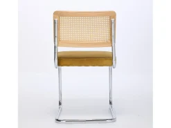 Silla de comedor - asiento voladizo de terciopelo con respaldo de ratán tejido dorado