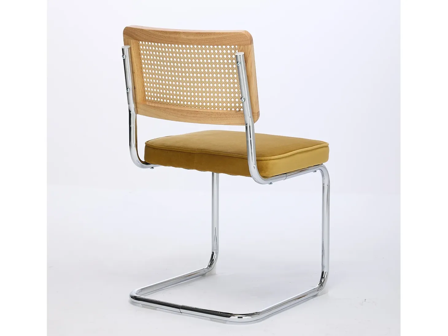 Silla de comedor - asiento voladizo de terciopelo con respaldo de ratán tejido dorado