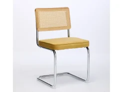 Silla de comedor - asiento voladizo de terciopelo con respaldo de ratán tejido dorado