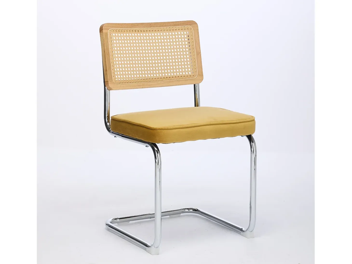 Silla de comedor - asiento voladizo de terciopelo con respaldo de ratán tejido dorado