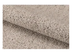 Silla de comedor Addi con reposabrazos bouclé beige.
